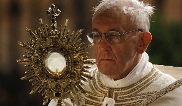 Pope Francis carries monstrance during observance of Corpus Christi feast